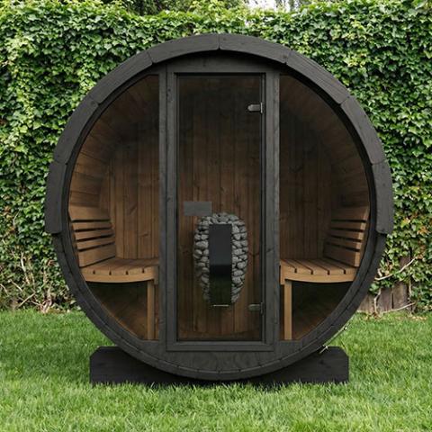 SaunaLife E7GB black glass-front barrel sauna on lawn before a hedge