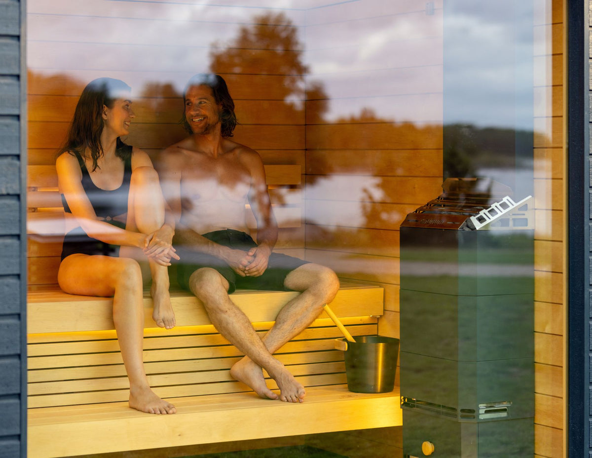 Saunum Air heater in a glass-front sauna