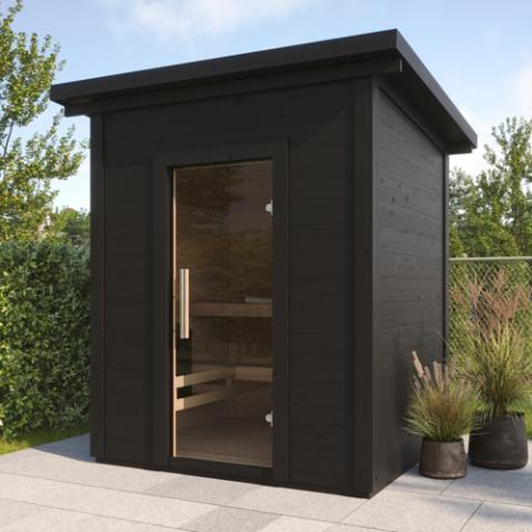 SaunaLife G2B black cabin sauna with glass door on patio beside hedges