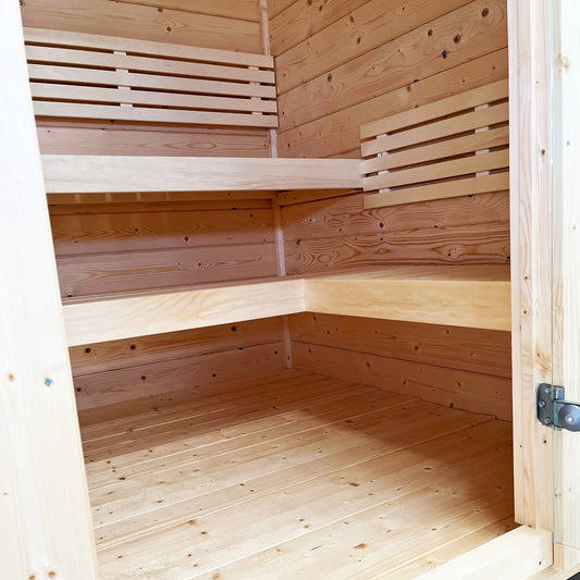 SaunaLife G2B interior L-shaped benches with slatted backrests through doorway